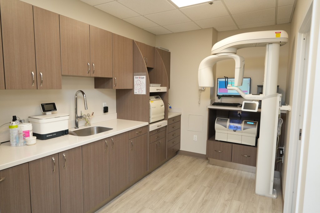 Modern dental office sterilization and treatment preparation area.