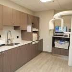 Modern dental office sterilization and treatment preparation area.